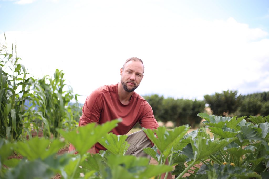 Veteran works in vegetable garden for therapy