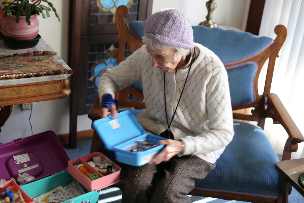 Mary Grace McDermott inspecting her foot care kit. Photo by Julie Showers