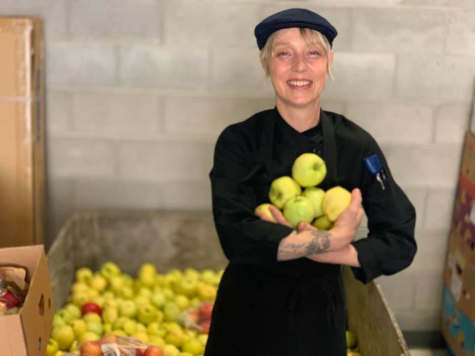Chef Shannon Chasteen inspects all donated fruit like these apples to help keep a sustainable nonprofit kitchen.