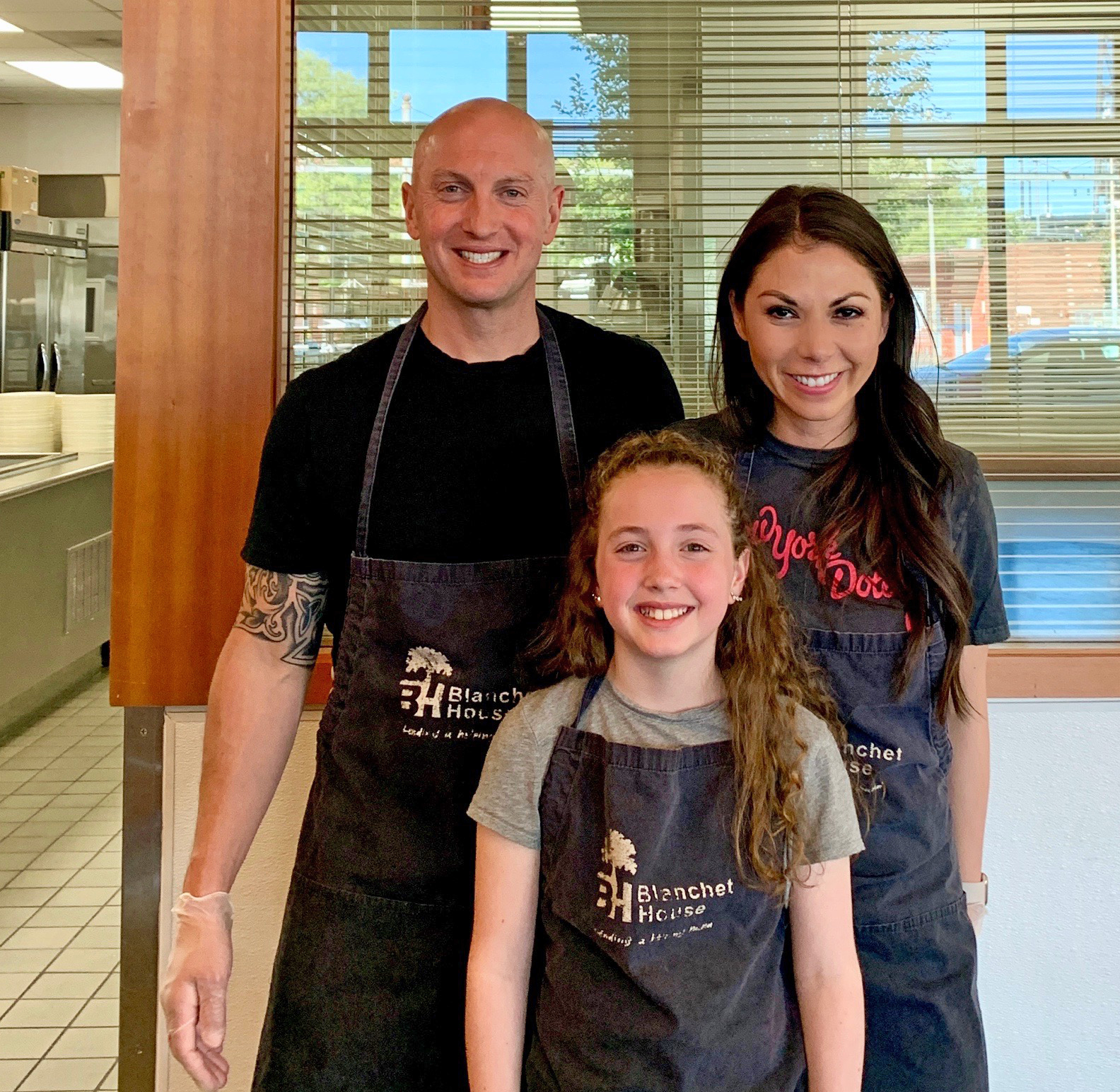 Reagan, Tommy and Jolyn Fieweger volunteer at Blanchet House.