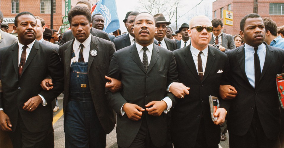 Martin Luther King Jr marching in color