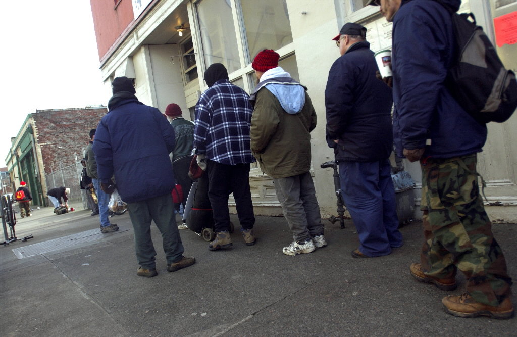 People wait in line for a meal outside Portland's Blanchet House of Hospitality in 2008.