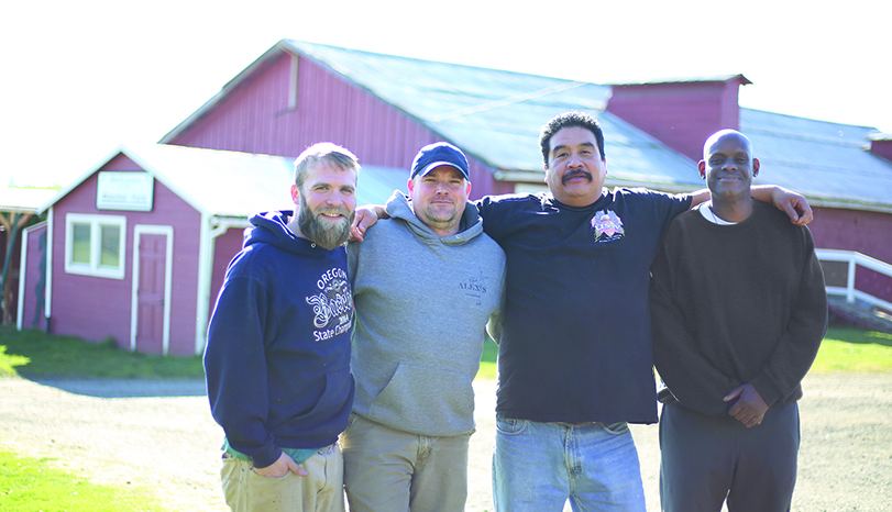 Men outside at Blanchet Farm a rural addiction recovery residential program