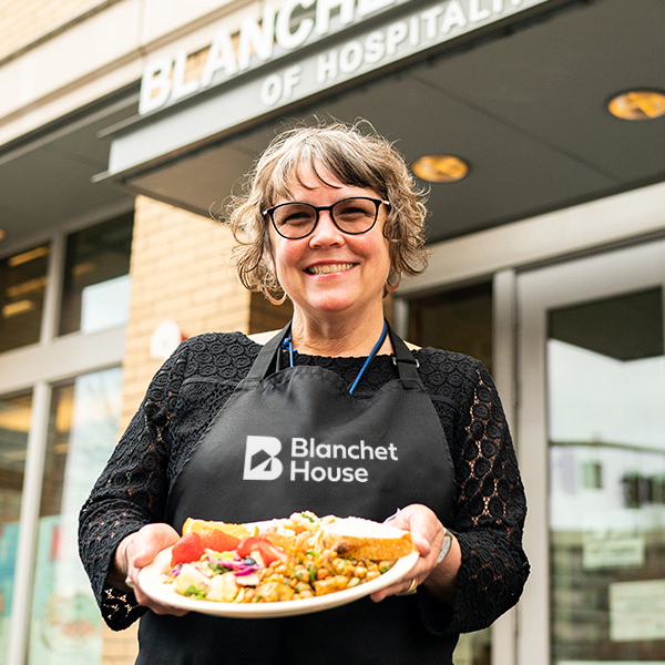 Holding Plate of Food Outside Blanchet House