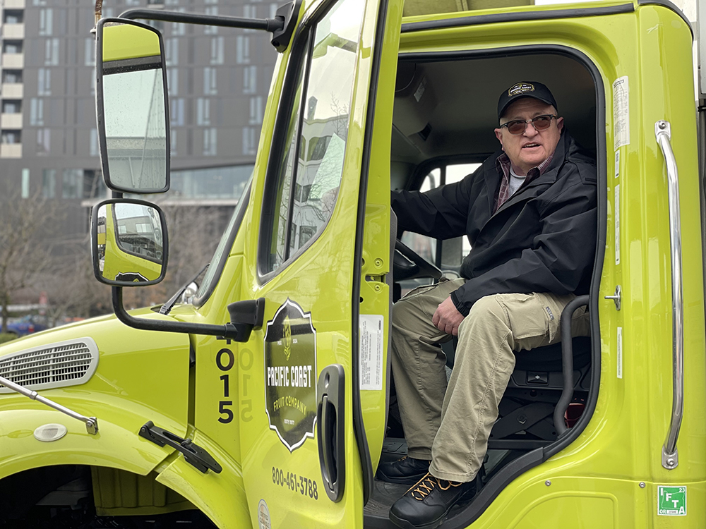 John Andersson a Pacific Coast Fruit truck performs meaningful work