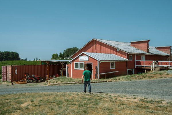 https://blanchethouse.org/wp-content/uploads/2023/07/Blanchet-Farm-Ross-walking-in-front-of-red-bard-by-Kaveer-Rai-2023-600x403.jpg