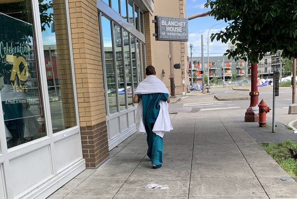 Untreated Mental Illness Woman walking in hospital scrubs