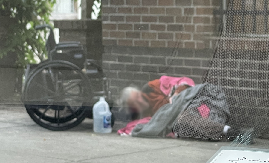 man laying on sidewalk Older adults homeless