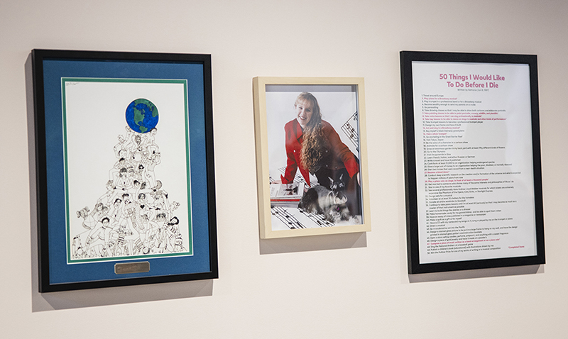 Displayed together are a senior portrait of Bethanie, an award-winning drawing she created, and her handwritten list titled 50 Things I Want to Do Before I Die.