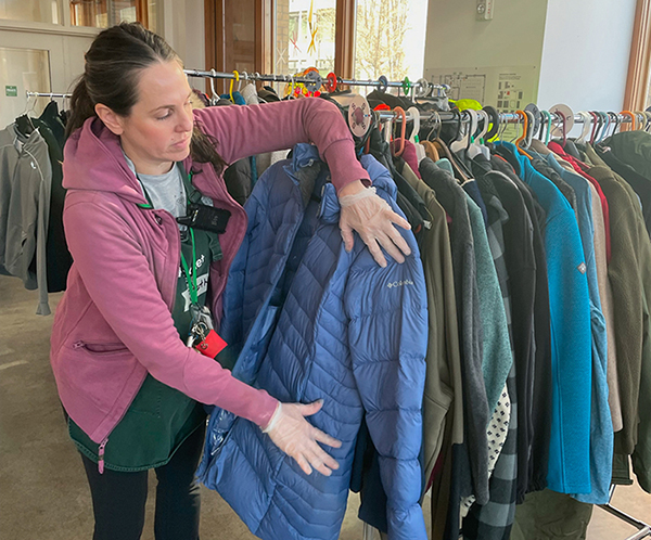 Staff sort donated jackets coats clothing insecurity blanchet house